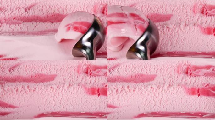 慢动作草莓冰淇淋用勺子舀。