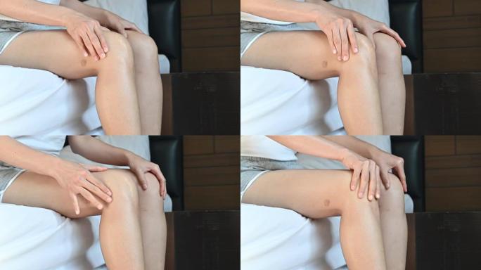 女人按摩膝盖导致膝盖疼痛。