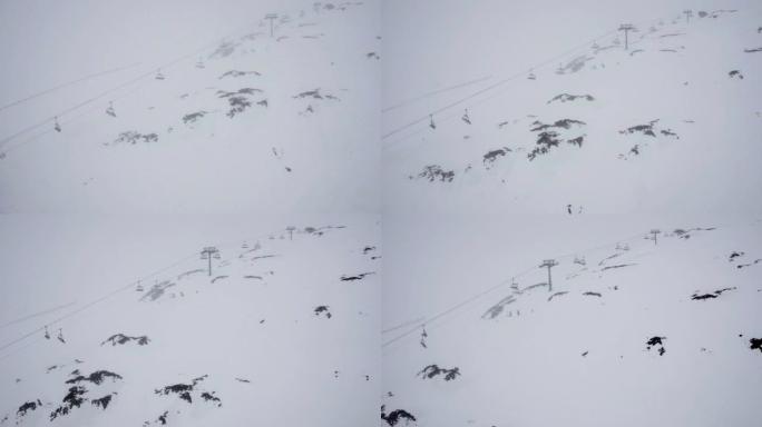 安装升降椅，将滑雪者运送到深谷上，而滑雪道外面下雪又有雾