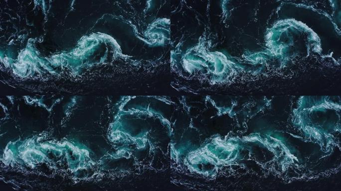 在涨潮和退潮期间，河流和大海的水波相遇。深蓝色暴风雨海水表面白色泡沫和波浪图案，背景纹理
