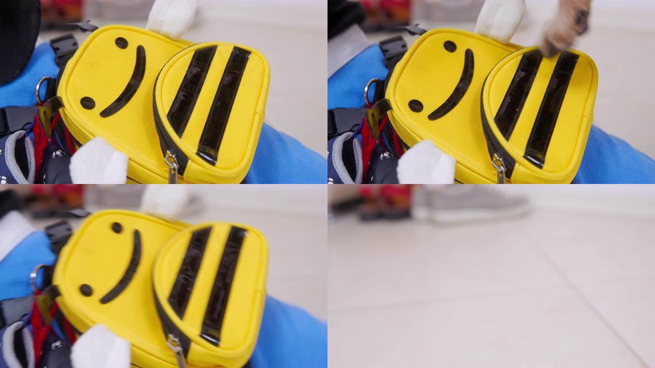 狗爪子在黄色公文包上敲击的特写镜头。