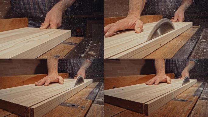 SLO MO DS男木匠在桌锯上切割木板