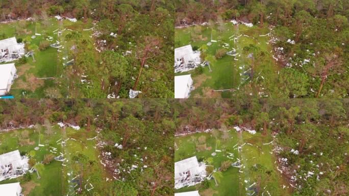 4k无人机视频显示佛罗里达州北港被飓风伊恩摧毁的房屋中的树木碎片-20