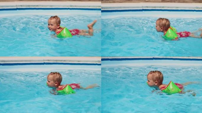 可爱的小女孩暑假在游泳池里学习游泳
