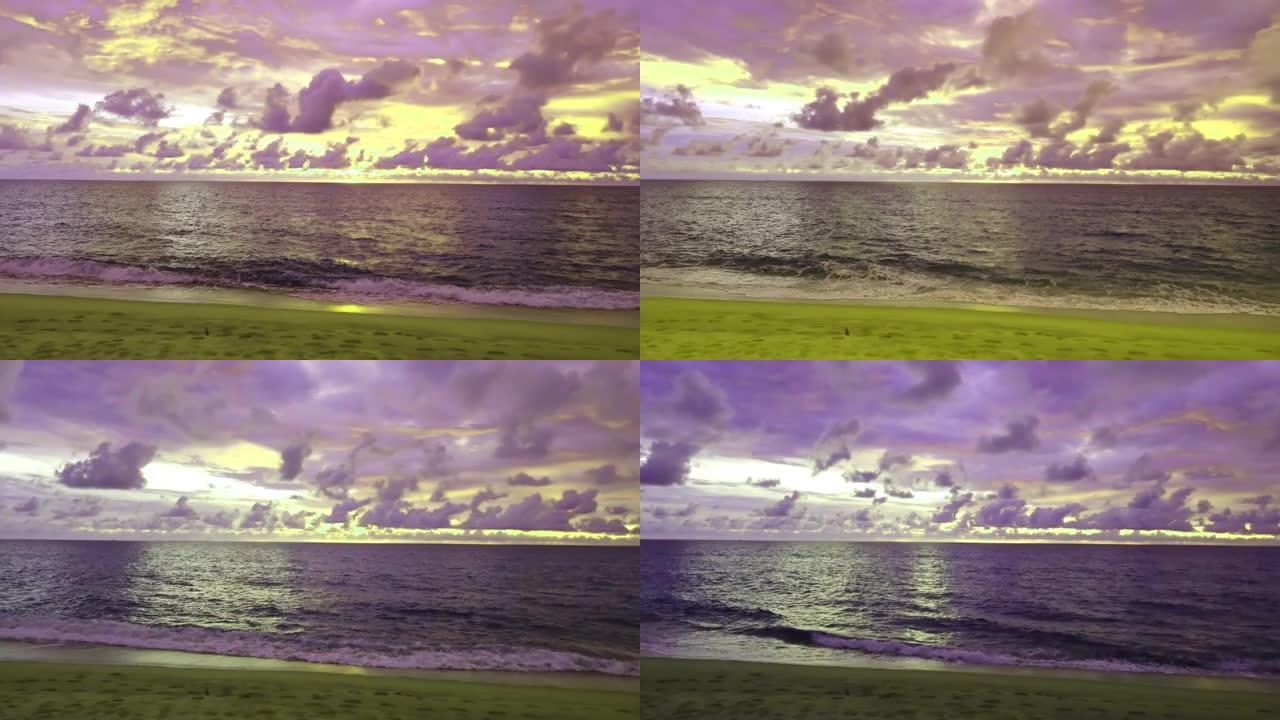 热带夏季海滩，带柔和的紫色粉色日落天空n红色橙色黄云或暗雷雨风暴云景