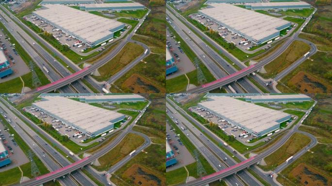 仓库，高速公路附近巨大的物流中心，大量货物拖车和集装箱的视野，国际货物运输，鸟瞰图。