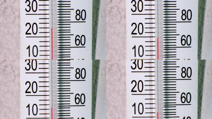 气候的变化。水银温度计指示外部空气温度下降。温度降低30度，温度计上的热量降低10度。从温暖的夏天到