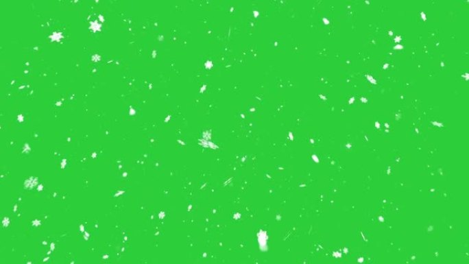 绿色背景上慢慢落下的雪花