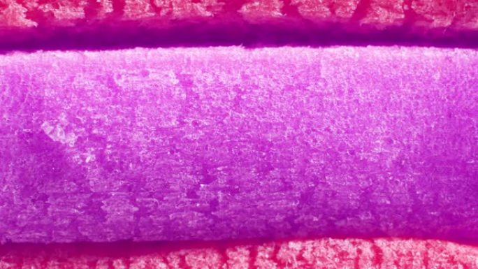 红色猩红色紫色泡泡糖纹理无缝循环。新鲜软糖美味背景。美味的背景。宏观特写。