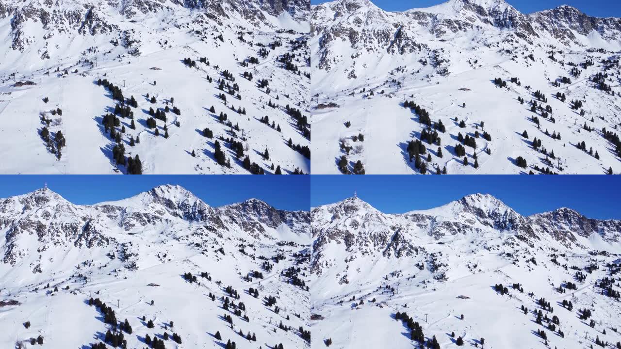 在田园诗般的美丽的冬日，在奥地利Obertauern巨大的滑雪区空中移动4k视图