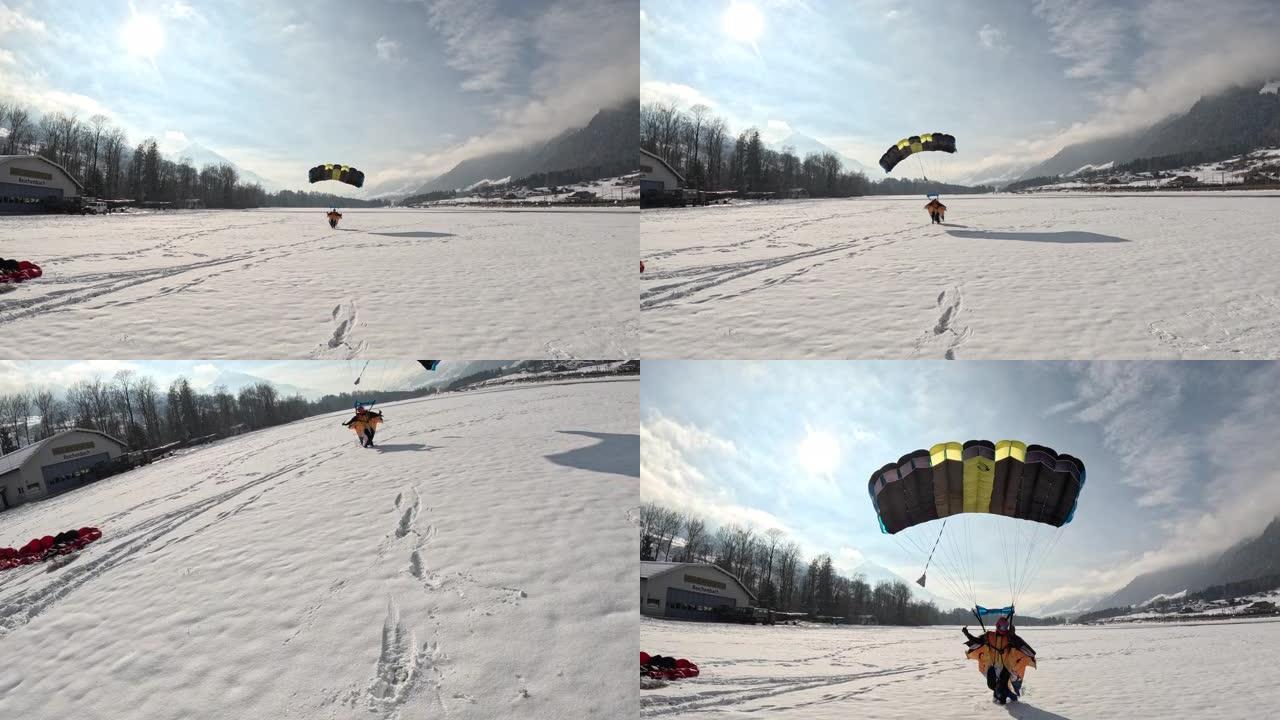 翼服飞行者降落在瑞士山区景观中