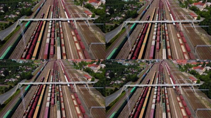 火车站的高角度视图，有许多轨道和火车停放并在4k中运动