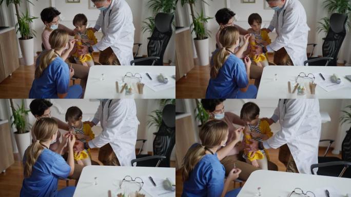 儿科护士给小女孩接种疫苗