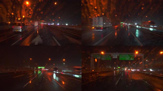 雨夜在高速公路上开车。挡风玻璃上的水滴