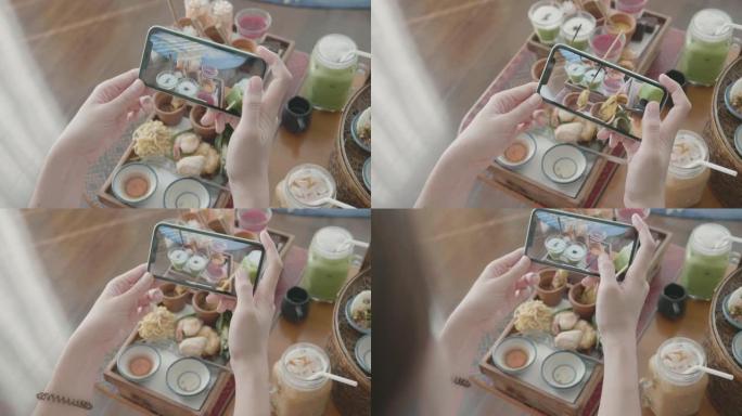 女人给自己的饭菜拍照并分享给社交媒体