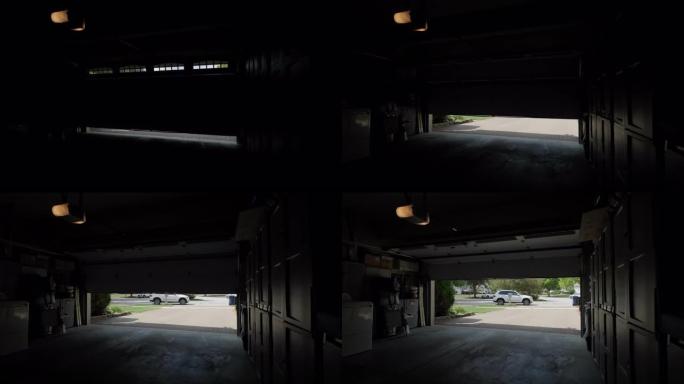 车库门开口向下移动。内部视图镜头