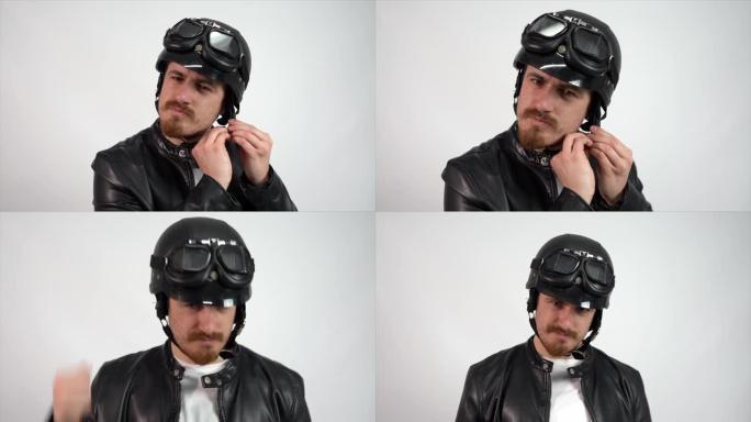 年轻的西班牙男子穿着皮夹克检查摩托车头盔的耐用性