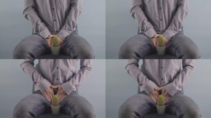 男子坐在椅子上前列腺问题概念工作室拍摄男子健康