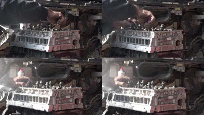 汽车修理厂的手动装配螺钉发动机缸体