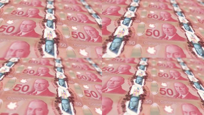 加拿大元印刷机打印出当前100美元钞票，无缝循环，加拿大货币背景，4K，聚焦深度Smoot和尼斯股票