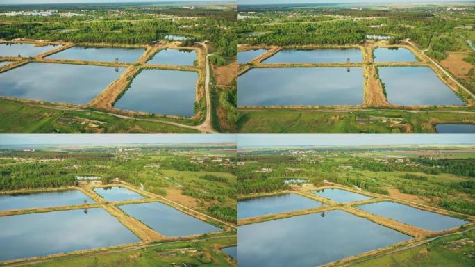 鸟瞰图保留池，湿池，湿滞留池或雨水管理池，是一个人工池塘，周围有植被，在其设计中包括一个永久性的水池