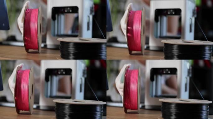 工程师为3D打印机特写镜头打开塑料