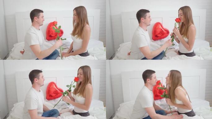 情人节惊喜。丈夫给妻子送了一朵玫瑰。女人睡觉