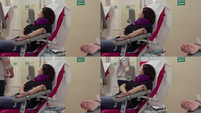 女人献血。专注于手。