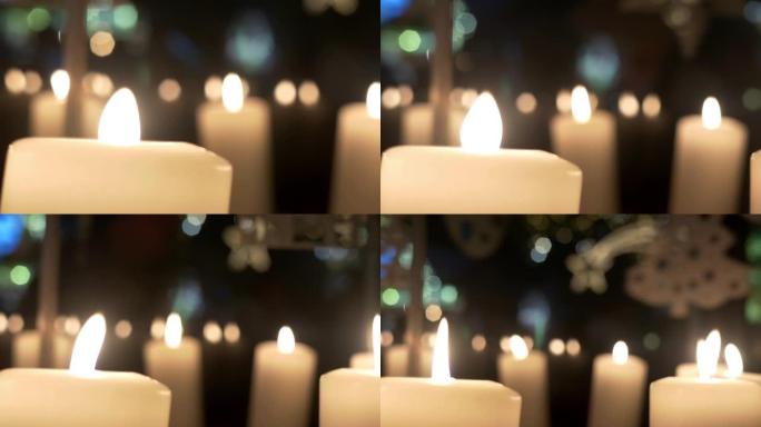 降临节白色蜡烛上的旋转装饰由胶合板制成，描绘天使或圣诞树15p2