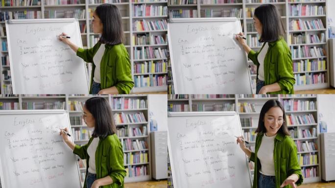 年轻的亚洲老师向英语学习者讲述新话题