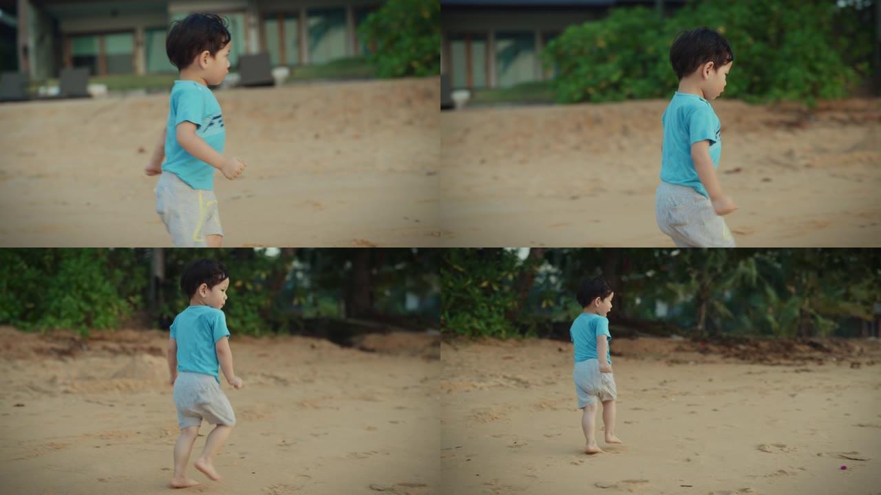 可爱的孩子在沙滩上奔跑和玩耍。