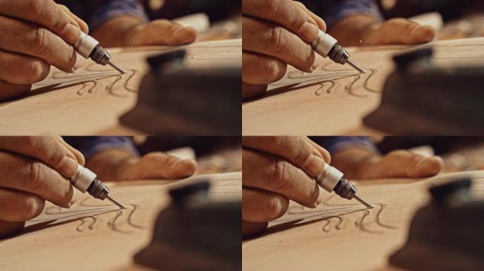 SLO MO男手使用电动雕刻工具并在木材中雕刻图案