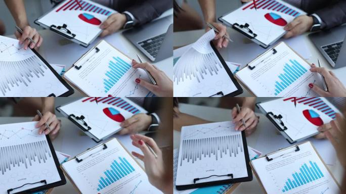 商务人士在会议上集思广益发表财务报告或销售图表