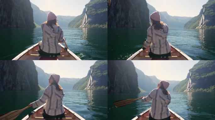 在挪威的湖上划独木舟的女人