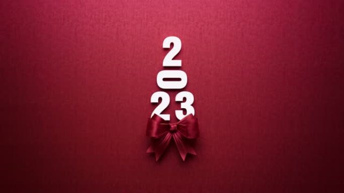 2023和红色领结在红色背景上形成圣诞树4 k分辨率