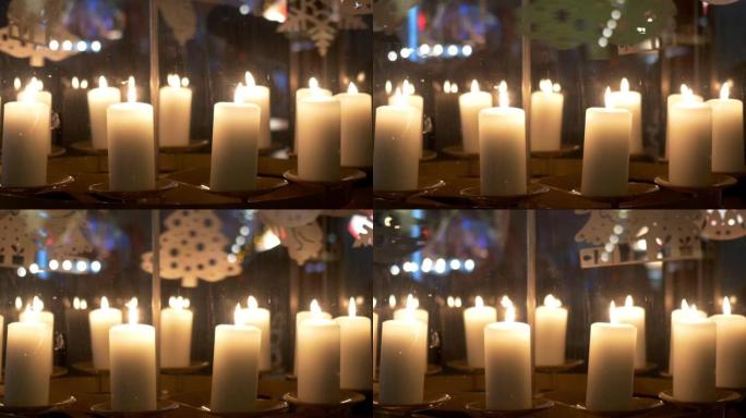 降临节白色蜡烛上的旋转装饰由胶合板制成，描绘天使或圣诞树10p1