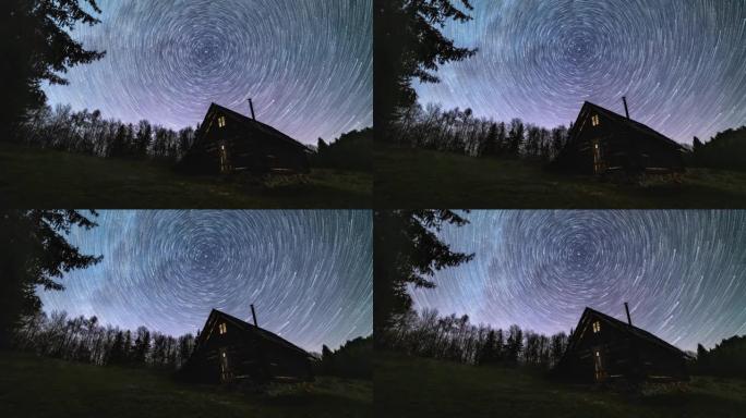 星际轨迹，银河系的恒星轨迹在夜空森林自然中古老的木屋上旋转