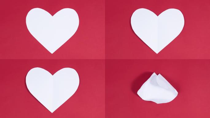 大白心出现在红色背景上。爱的象征。贺卡。情人节的概念