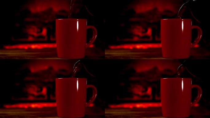 通过燃烧的壁炉将热饮咖啡或茶倒入木板上的红色杯子中。