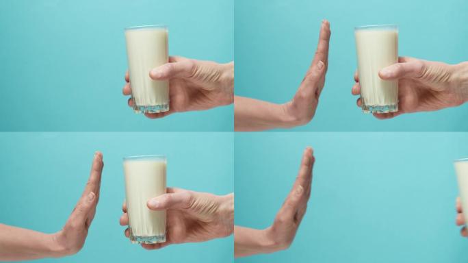 乳糖不耐受。一杯牛奶和手展示停止。