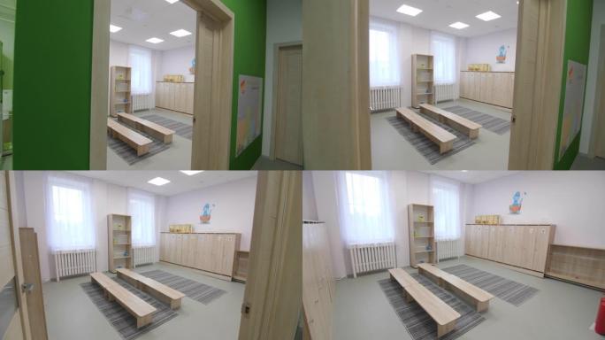 幼儿园更衣室的木凳和橱柜