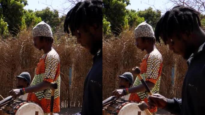 一群黑人一起演奏各种非洲乐器的垂直视频