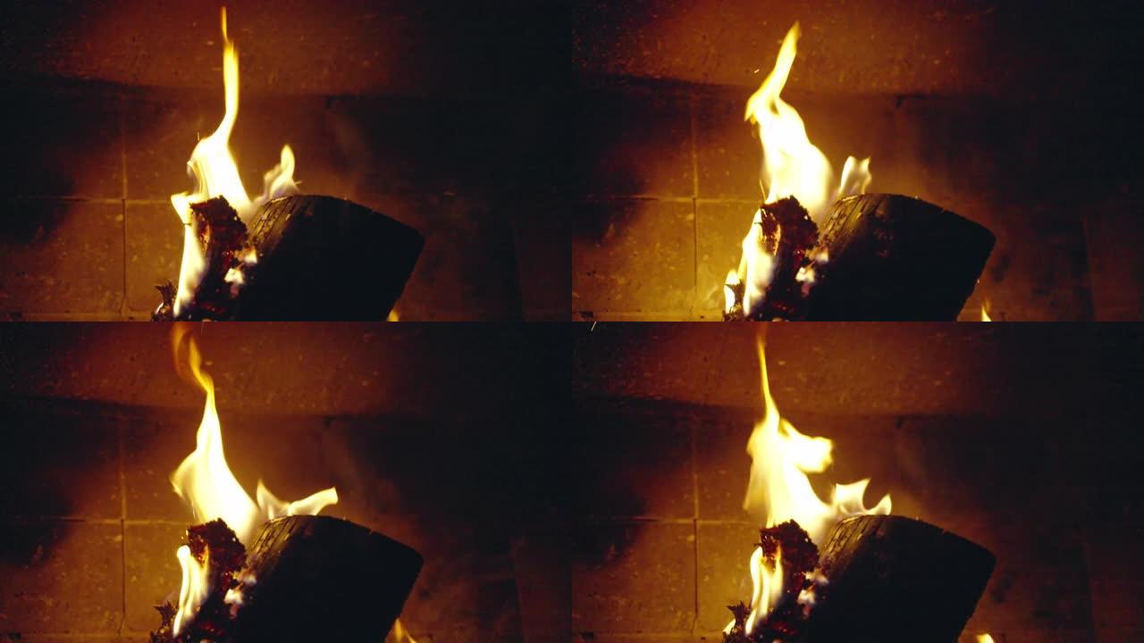 壁炉里燃烧的火，篝火里燃烧的黄色火焰和柴火，燃烧的火带来的热量和温暖，给家里取暖和放松时间概念