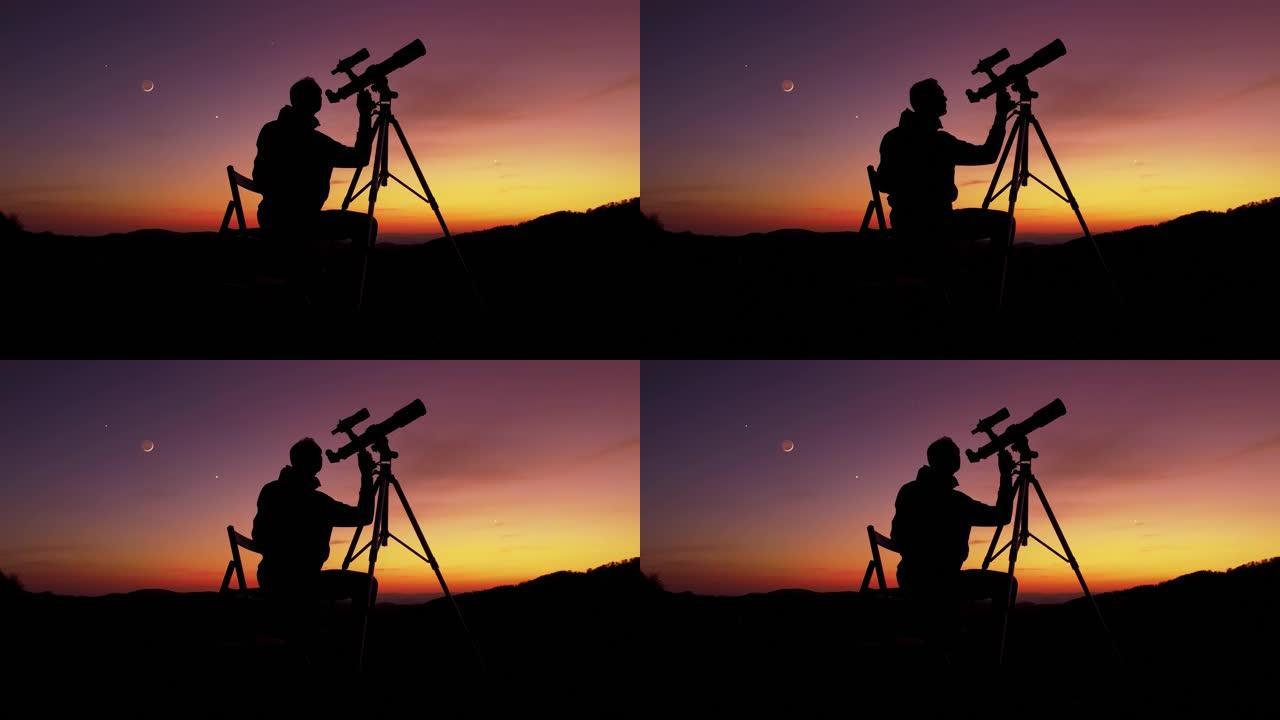 用天文望远镜看着夜空、星星、行星、月亮和流星的人。
