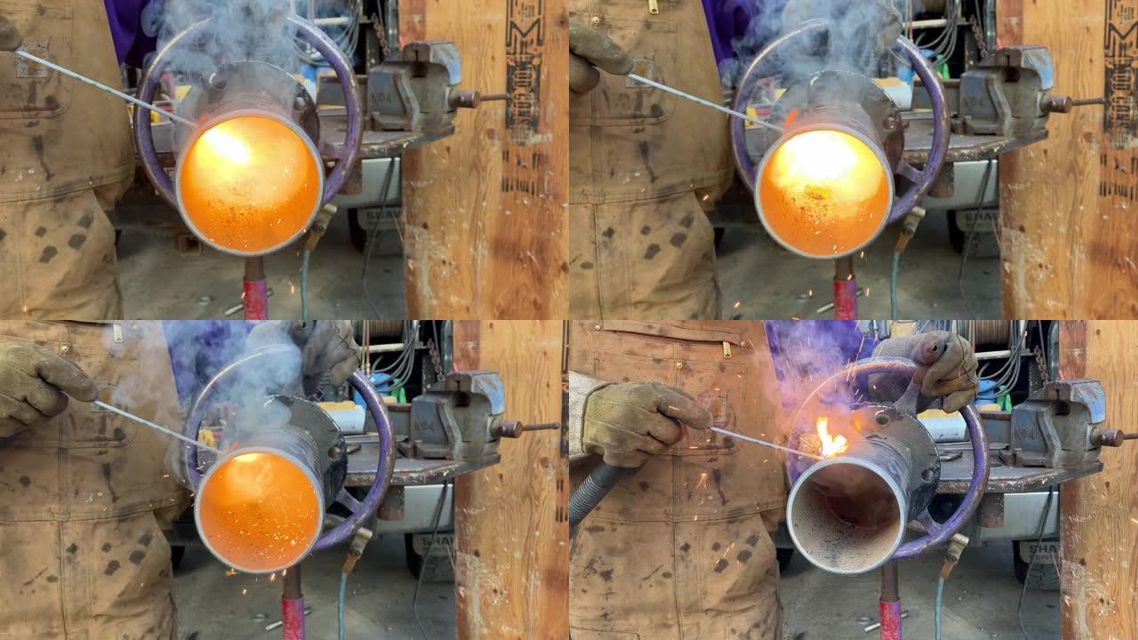 从焊接的金属管中喷出的火焰和火花的特写镜头