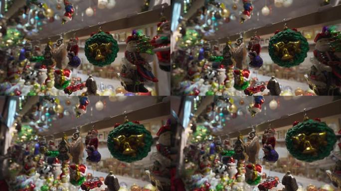 德国慕尼黑度假村市场摊位的详细视图。节日集市上的圣诞装饰品。出售装饰冬季玩具来庆祝。街头节出售的小雕