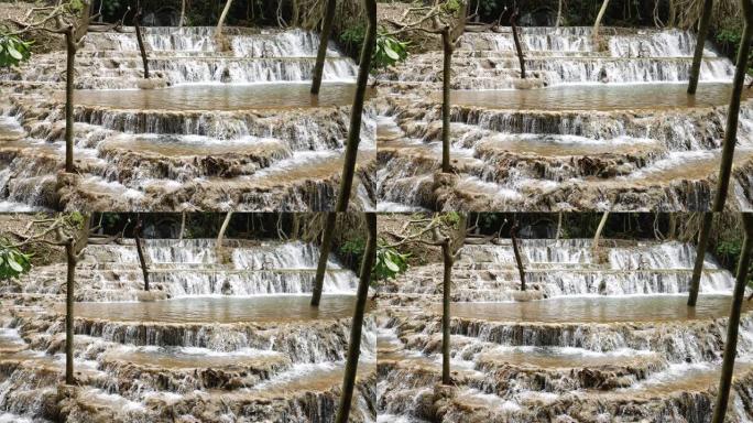 雨林中的瀑布水潭溪水水漫出