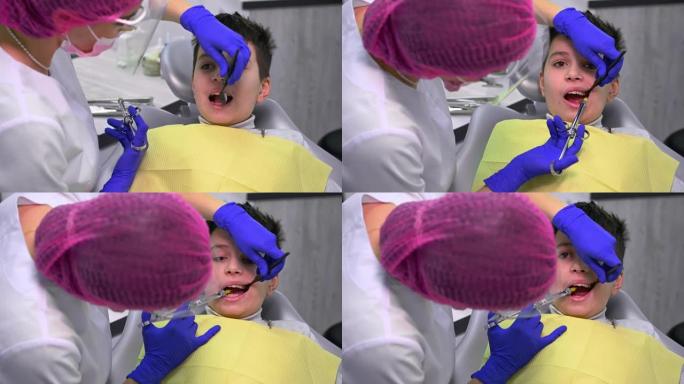 近距离牙医的儿童患者接受牙科麻醉，麻醉注射