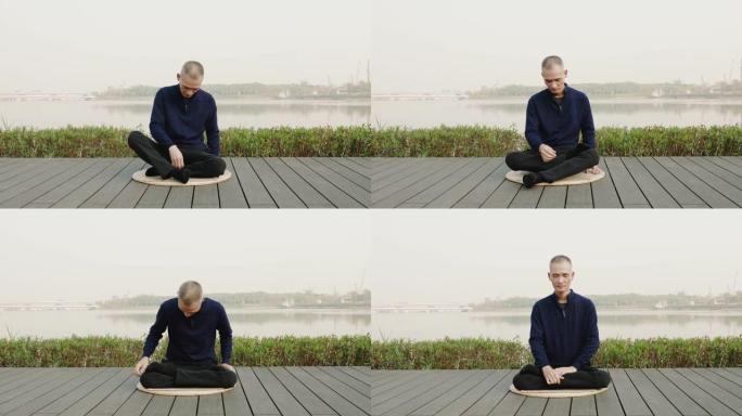 中国男子坐在深圳的湖畔