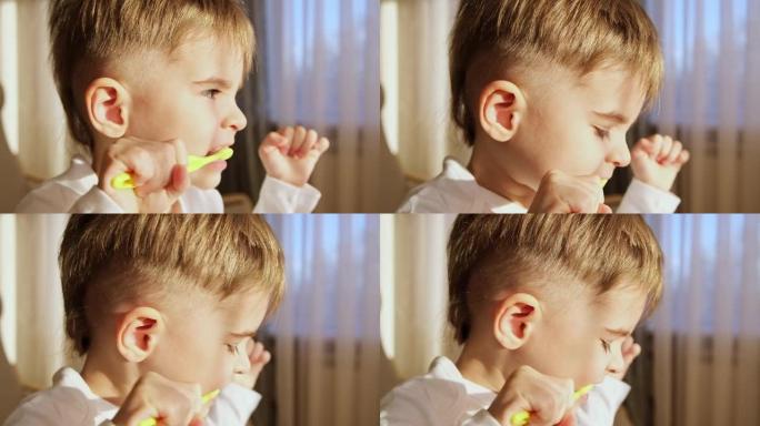 3岁的金发男孩蹒跚学步的孩子饭后在房间里用牙刷勤奋地刷牙。健康习惯。慢动作特写FHD